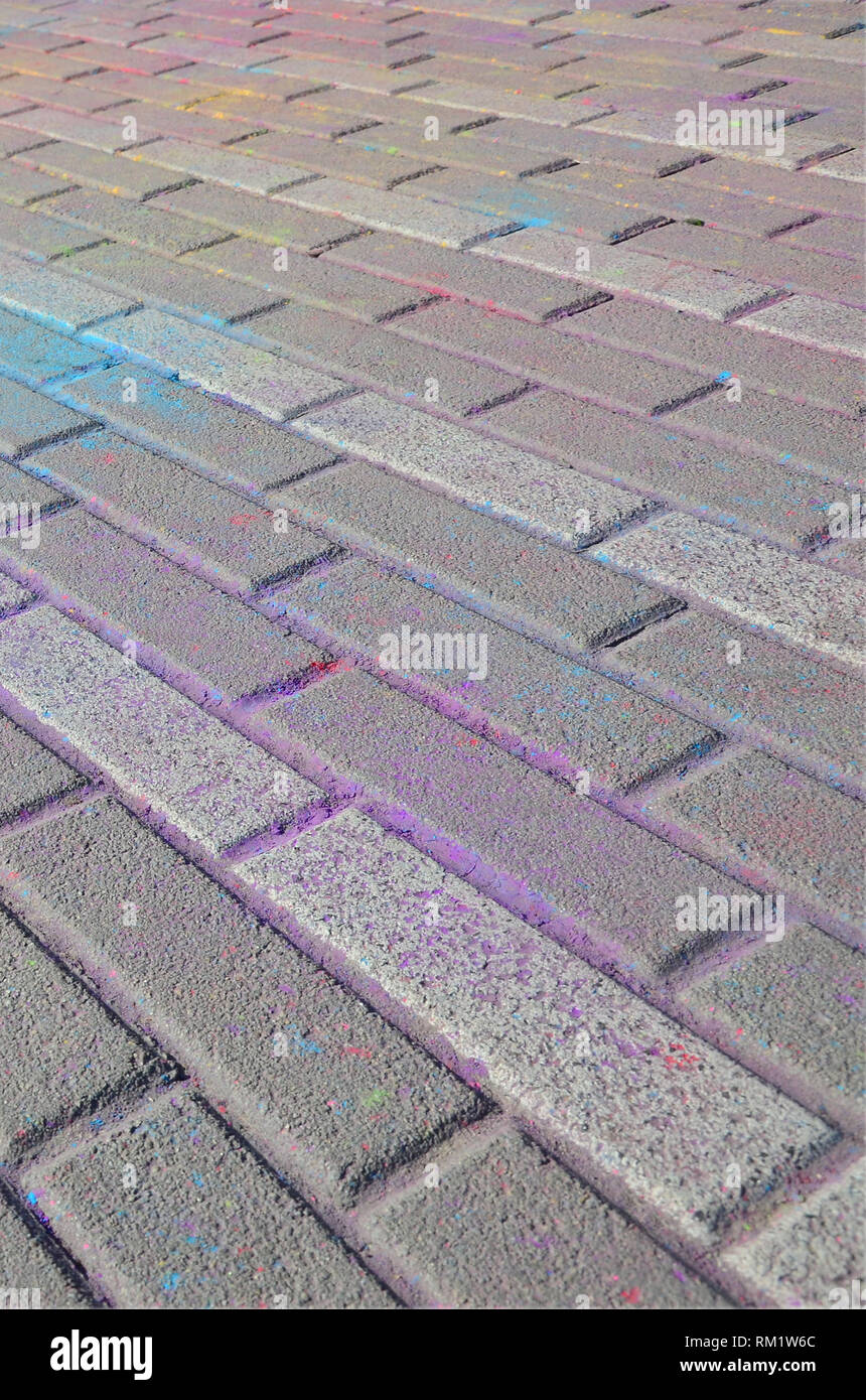 Multi colored earth, paving slabs, powder coated with dry colors at the ...