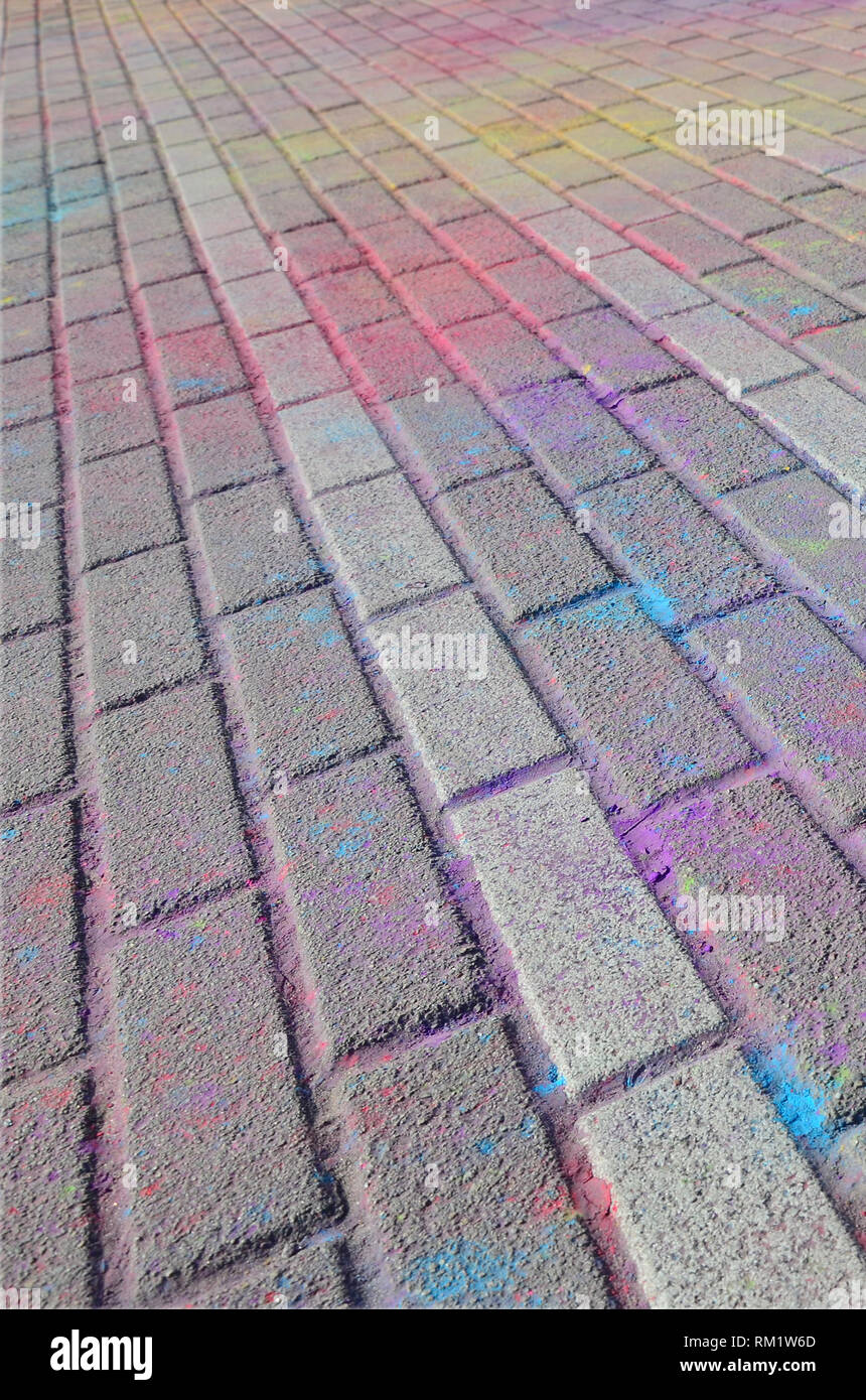 Multi colored earth, paving slabs, powder coated with dry colors at the ...