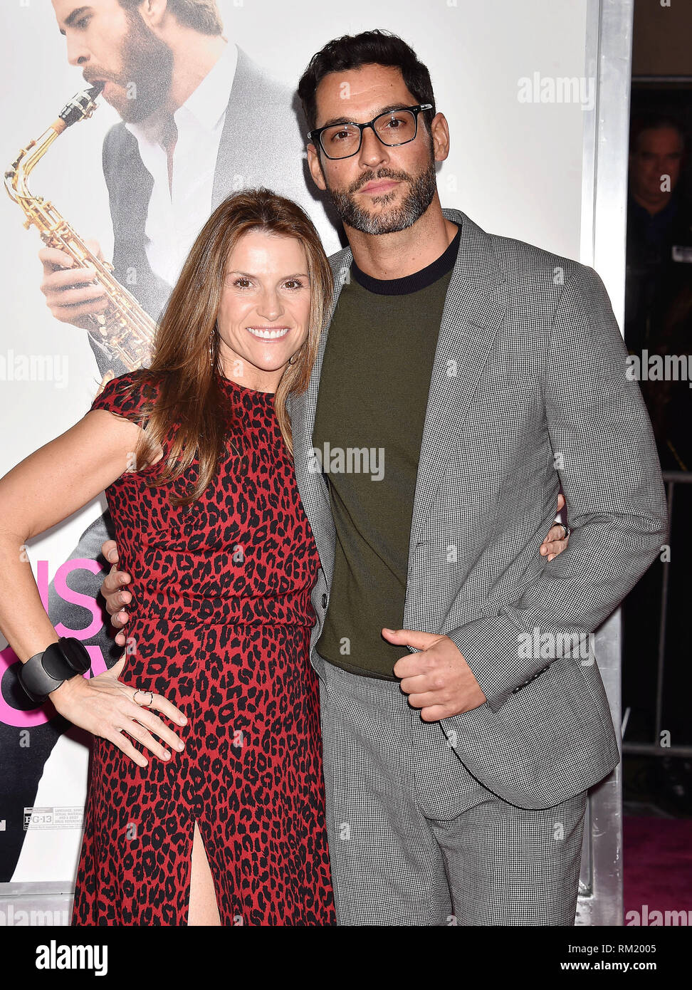 LOS ANGELES, CA - FEBRUARY 11: Gina Matthews (L) and Tom Ellis arrive at the Premiere Of Warner Bros. Pictures' 'Isn't It Romantic' at The Theatre at  Stock Photo