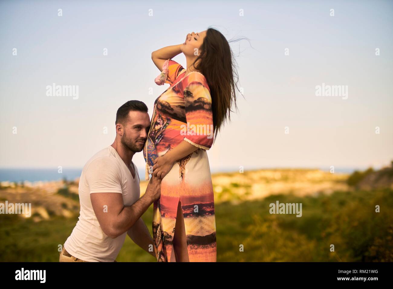 young couple, pregnancy, outdoors Stock Photo