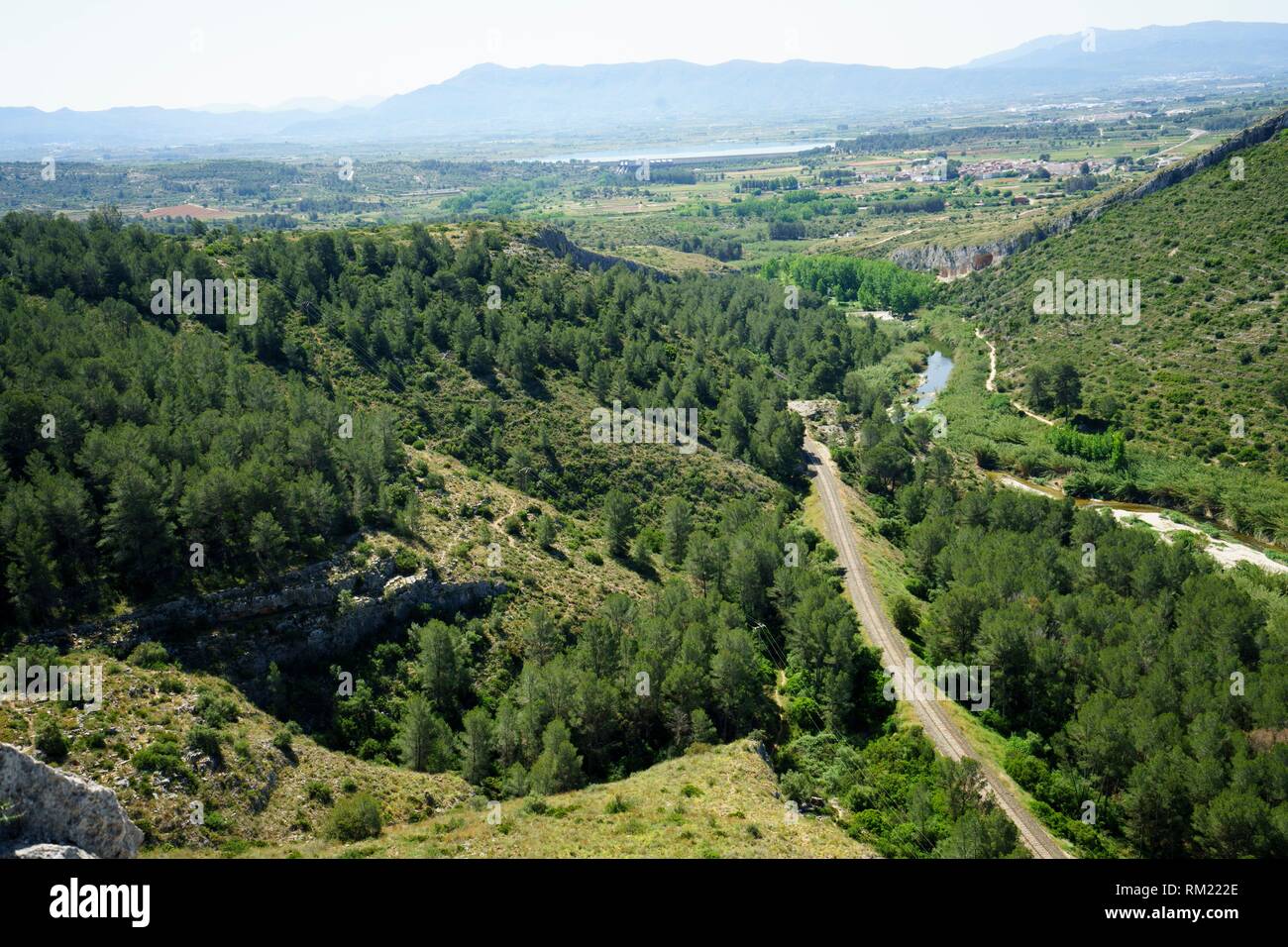 session Desperat Forge Natural landscape of the Xativa mountains, with the rails of the train and  the river Albaida. Genoves, Valencia, Spain Stock Photo - Alamy