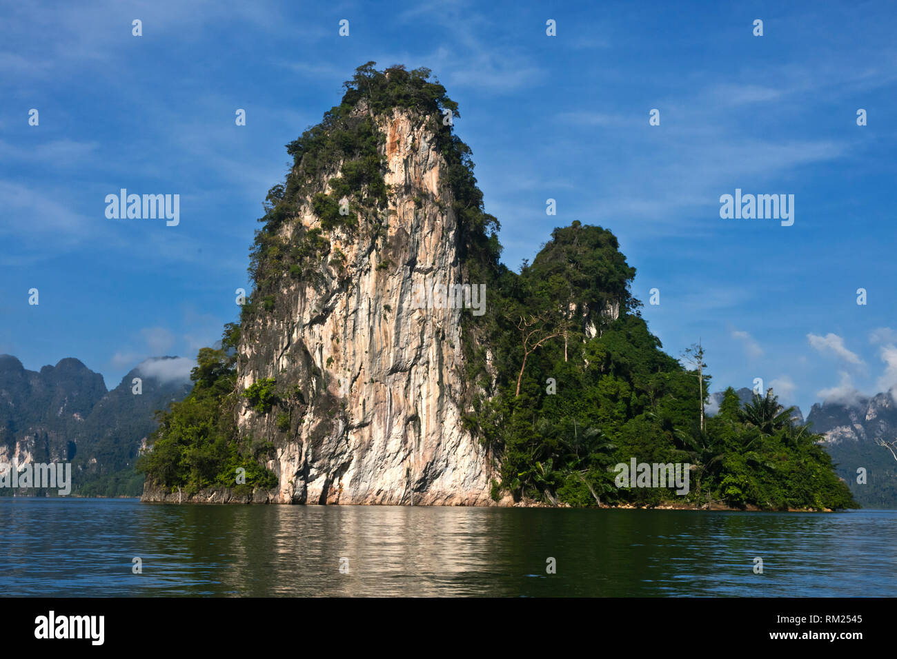 KARST FORMATIONS rise out of CHEOW LAN LAKE in KHAO SOK NATIONAL PARK - THAILAND Stock Photo