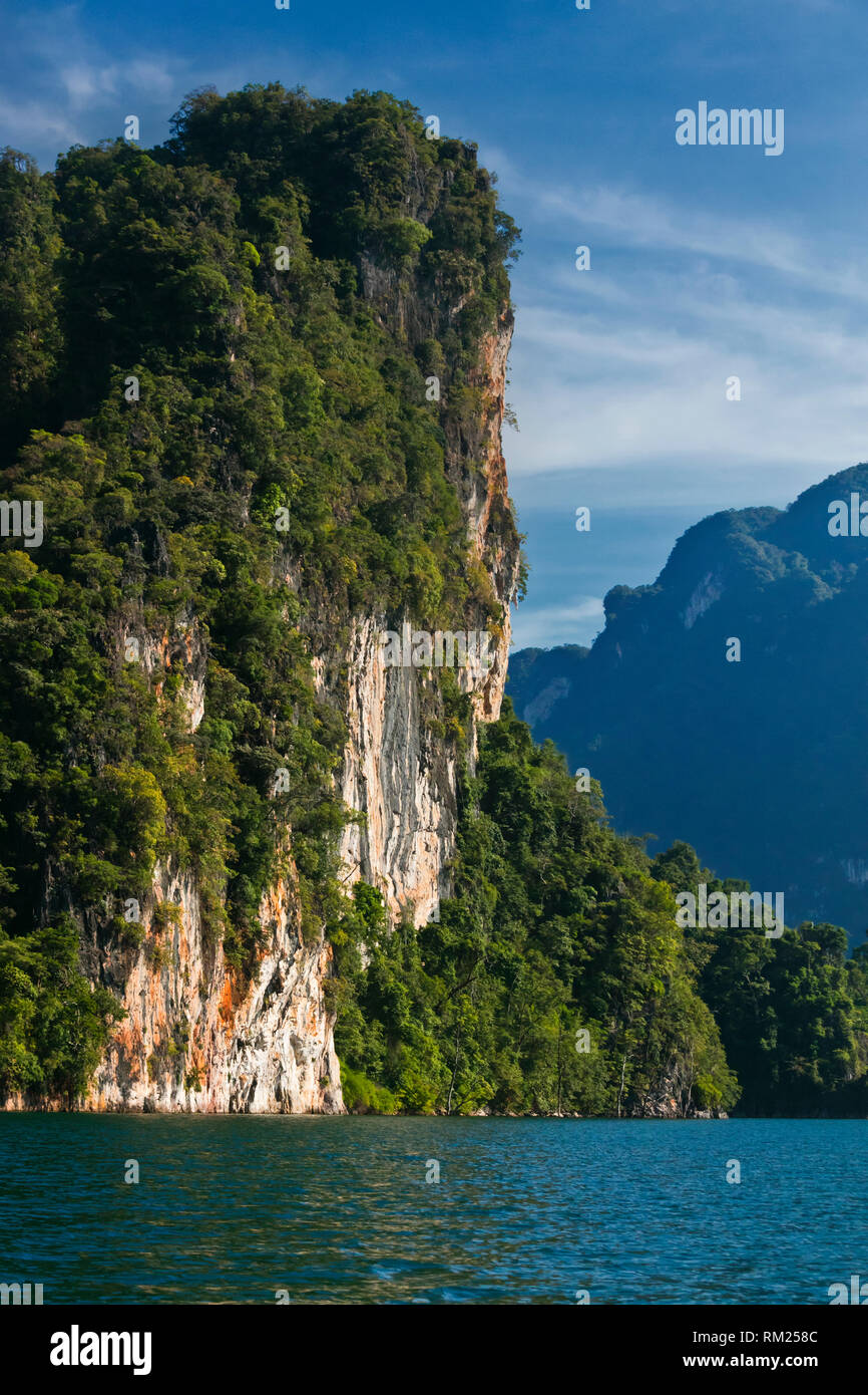 KARST FORMATIONS rise out of CHEOW LAN LAKE in KHAO SOK NATIONAL PARK - THAILAND Stock Photo