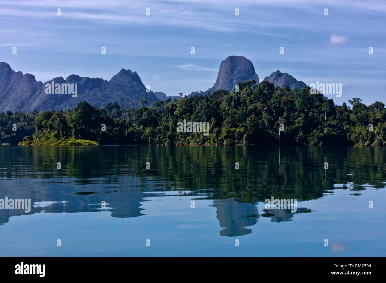 KARST FORMATIONS rise out of CHEOW LAN LAKE in KHAO SOK NATIONAL PARK - THAILAND Stock Photo