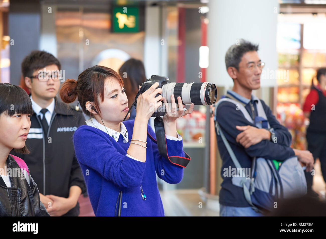 HONG KONG - DECEMBER 24, 2015: young woman taking photo during Magic ...