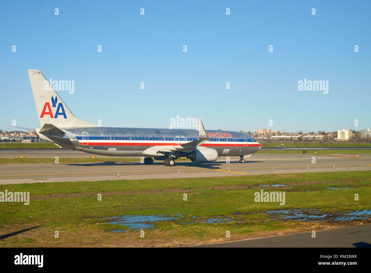 NEW YORK - APRIL 05, 2016: airplane at LaGuardia Airport. LaGuardia Airport is an international airport located in the northern part of Queens, New Yo Stock Photo
