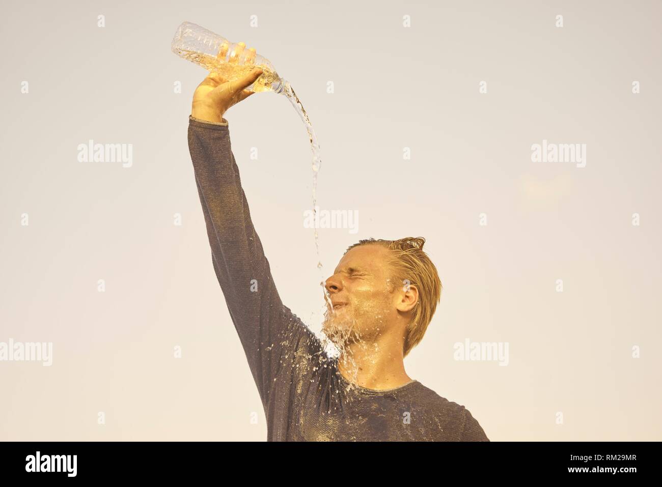 Pouring water over his head hires stock photography and images Alamy