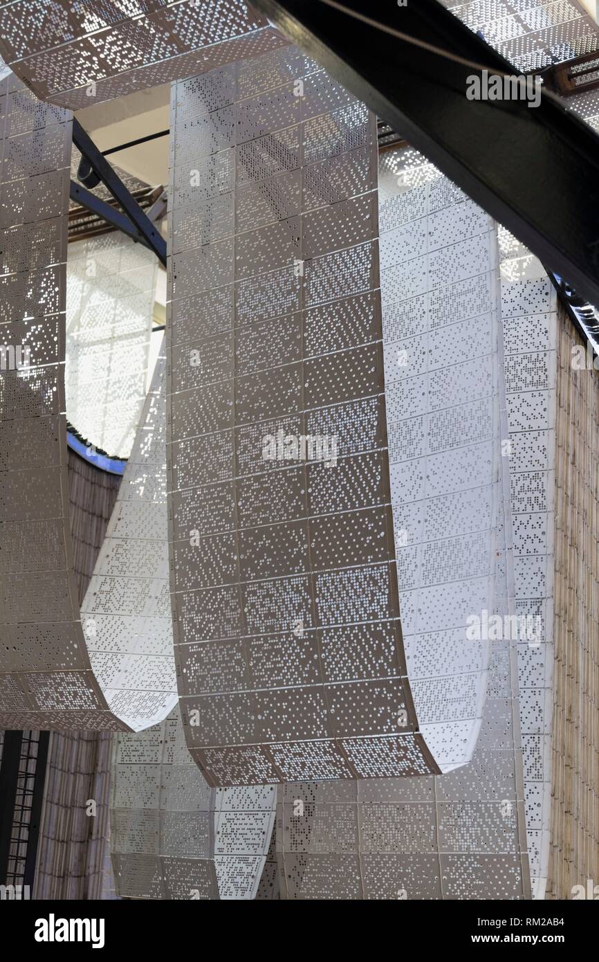 Gigantic, momentous three dimensional loops and hanging repeats of perforated pattern punch cards in traditional jacquard fabric weaving, La Stock Photo