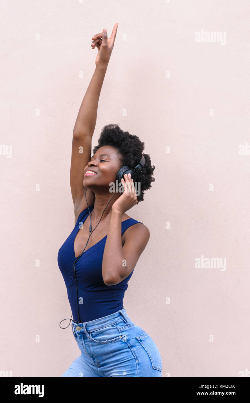 Happy black woman afro hi-res stock photography and images - Alamy