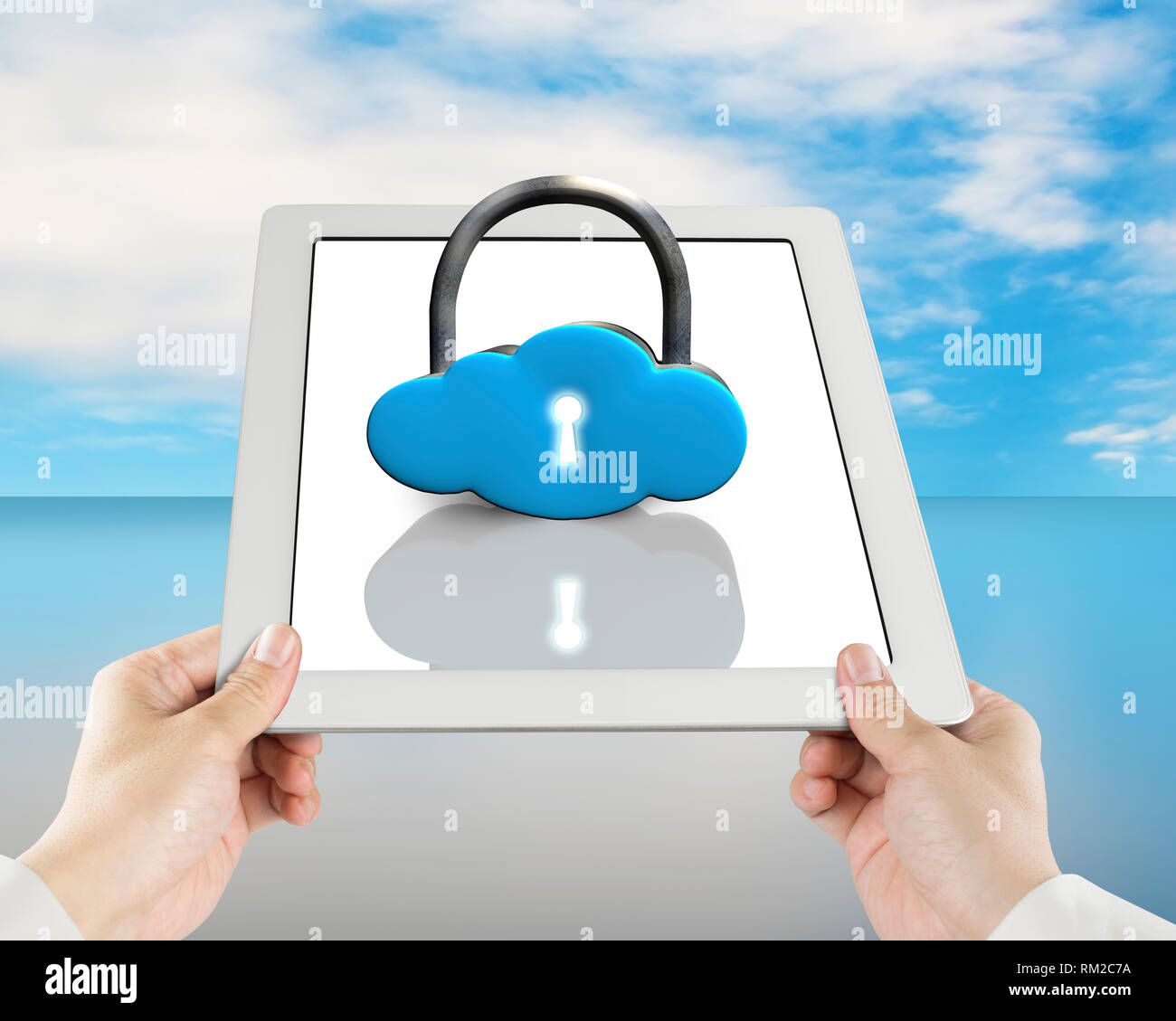 Cloud shape lock on tablet with hand holding blue sky background Stock Photo