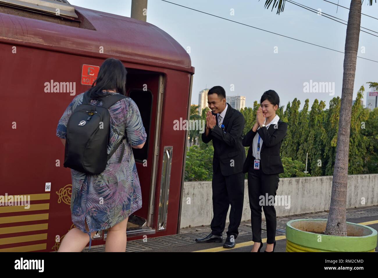 staff welcoming passengers for Priority Class car at Gambir railway station, Jakarta, Java island, Indonesia, Southeast Asia. Stock Photo