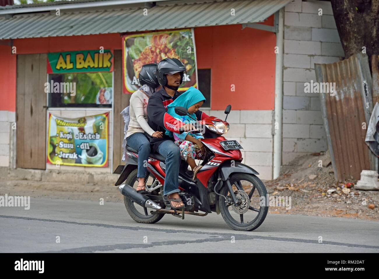 family on motorcycle, near Surakarta (Solo), Java island, Indonesia