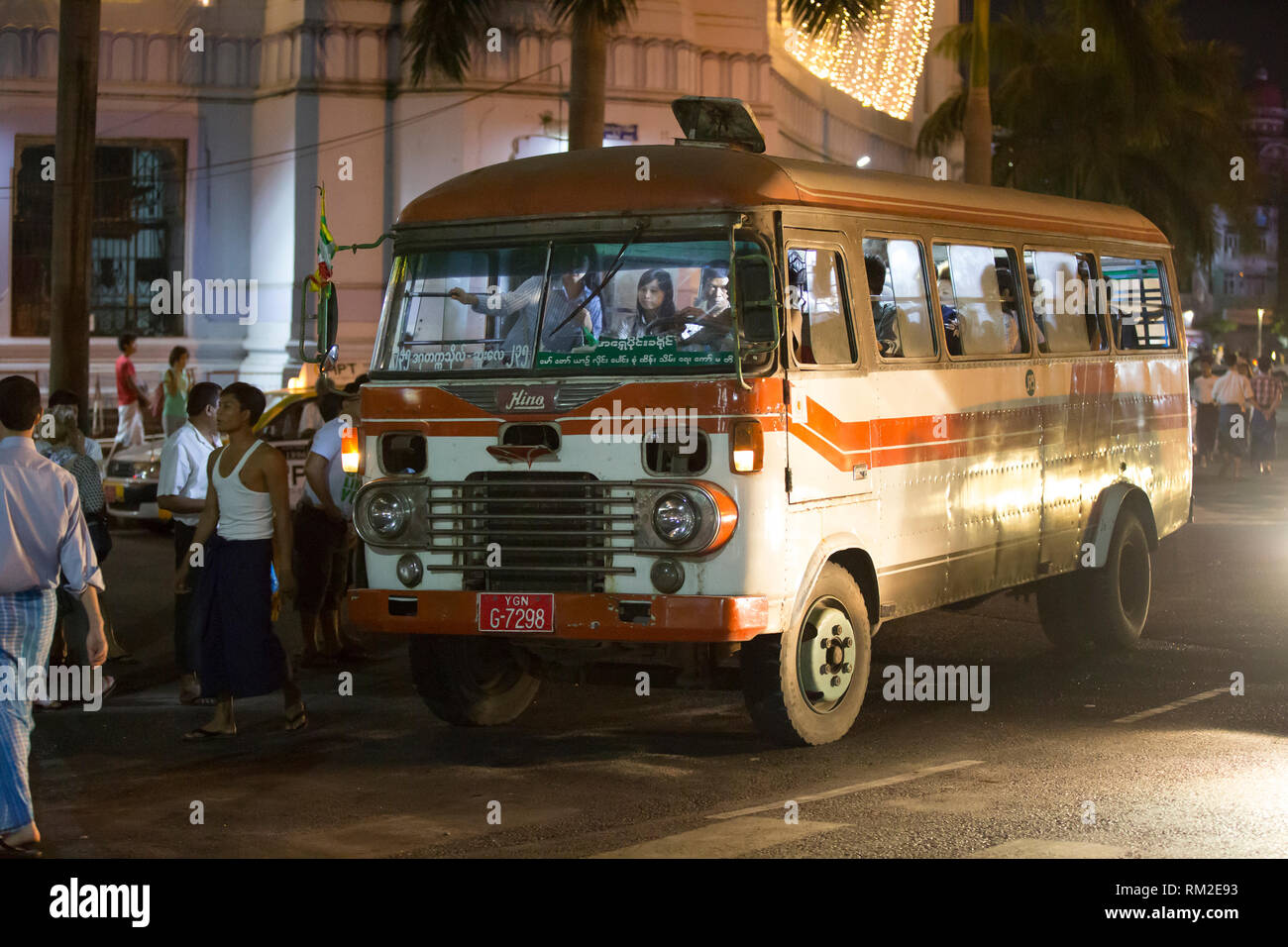 YANGON, MYANMAR - JANUARY 3, 2016: People commuting on a very old bus in Yangon , Myanmar on January 3, 2016 Stock Photo