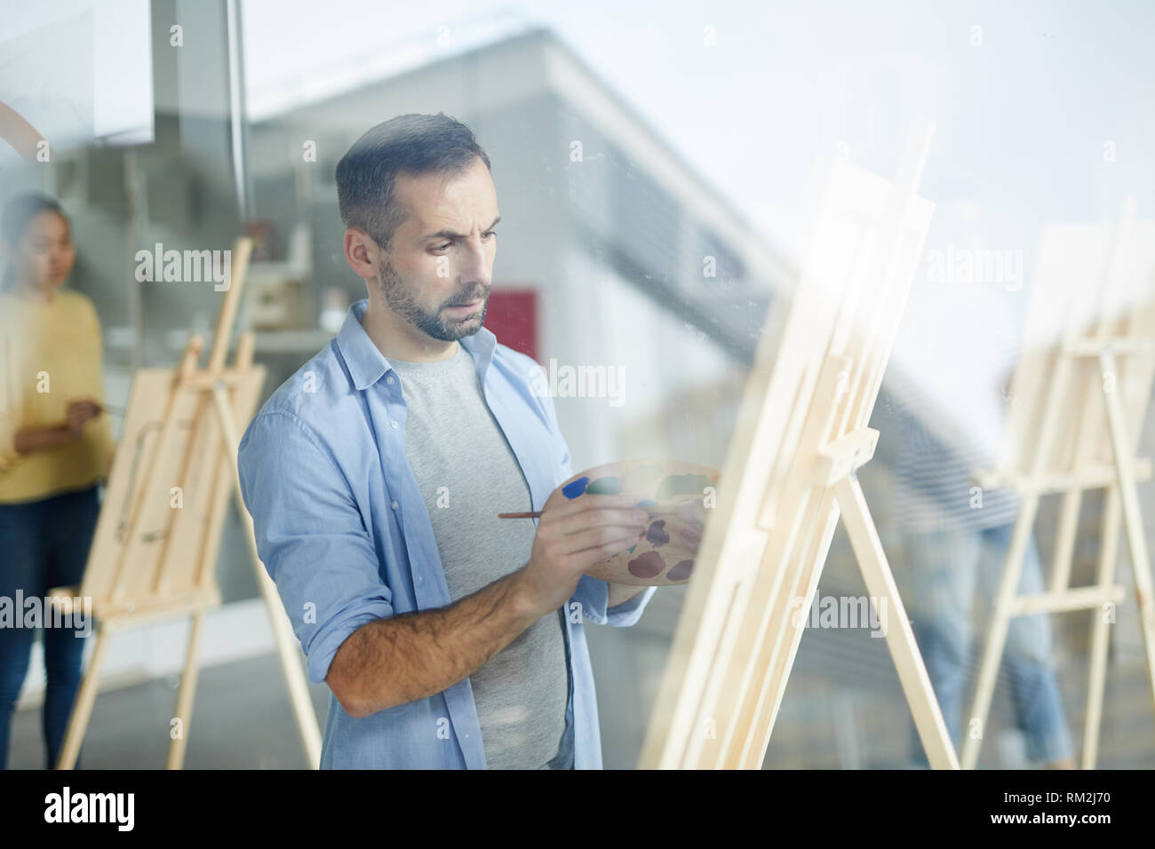 Working over painting Stock Photo