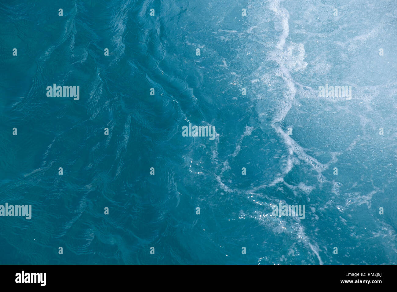 Blue wavy water surface as background Stock Photo