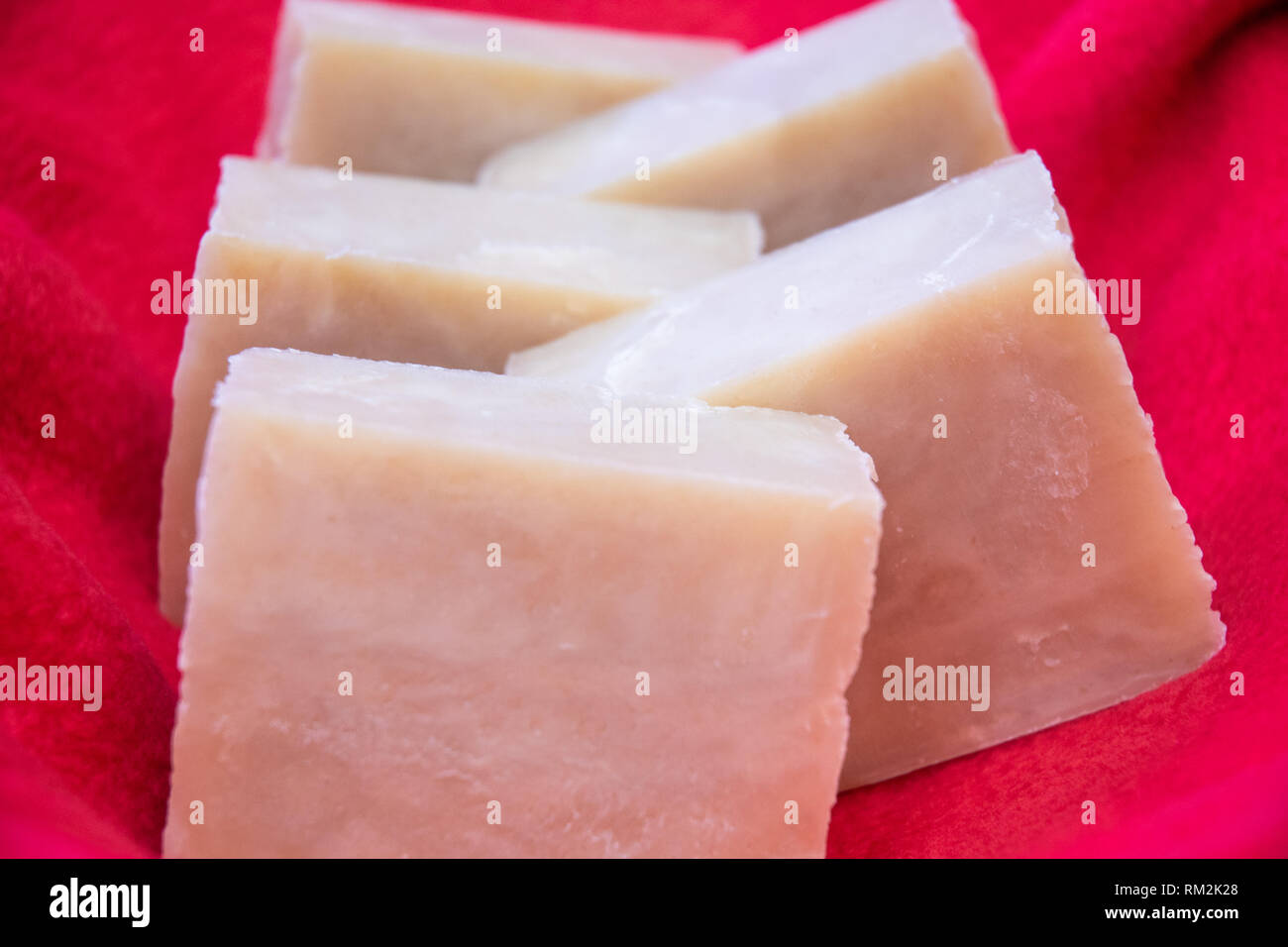 Hand crafted soaps on a red cloth. Stock Photo
