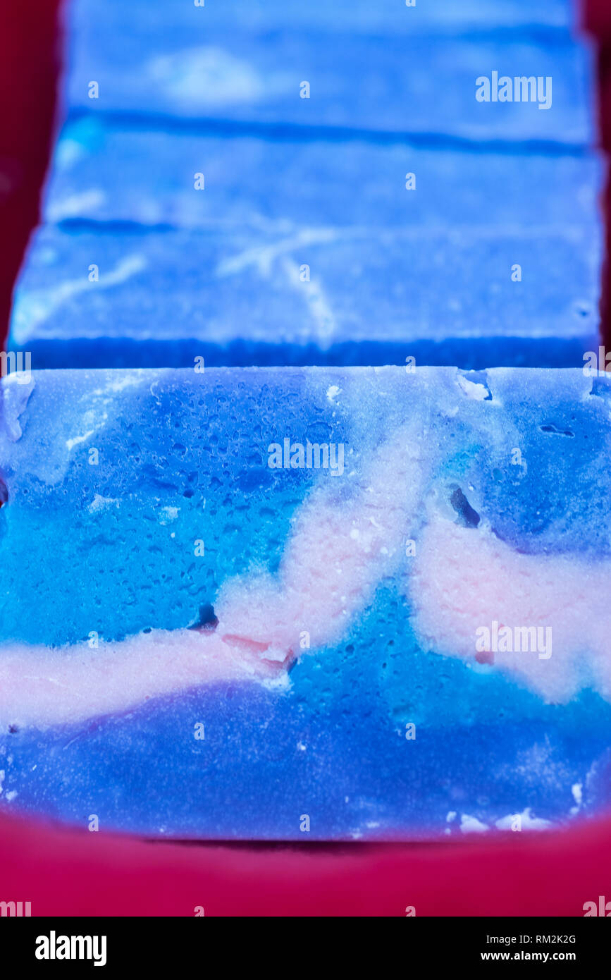 Several bars of multicolored handcrafted soap. Stock Photo