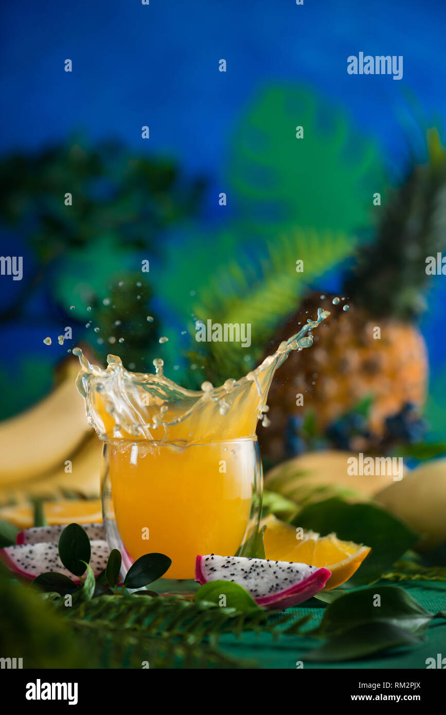 Fresh juice dynamic splash. Tropical fruits, bananas, pineapple, and dragon fruit. Exotic drink
