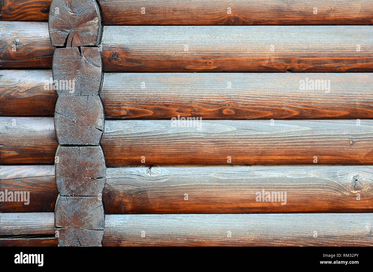Hewn timber. Rustic log wall horizontal timber background. Fragment of