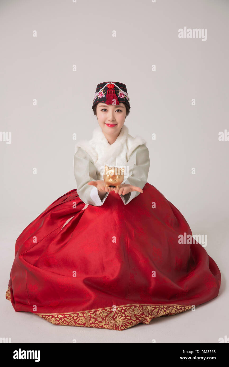 Korean beauty concept photo. Young beautiful woman wearing Hanbok, Korean traditional dress. 181 Stock Photo