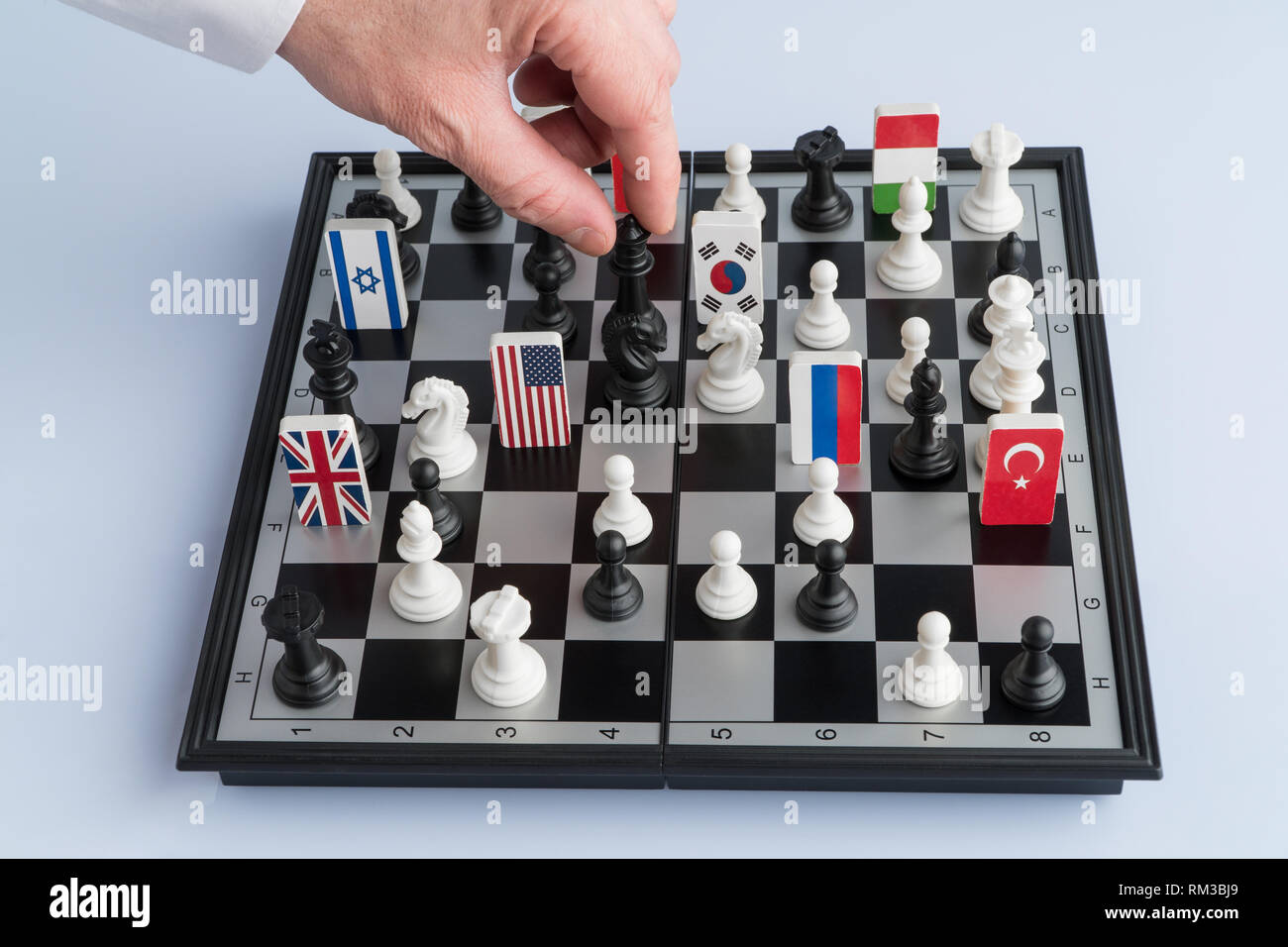 Politician S Hand Moves A Chess Piece Conceptual Photo Of A Political Game And Strategy Stock Photo Alamy