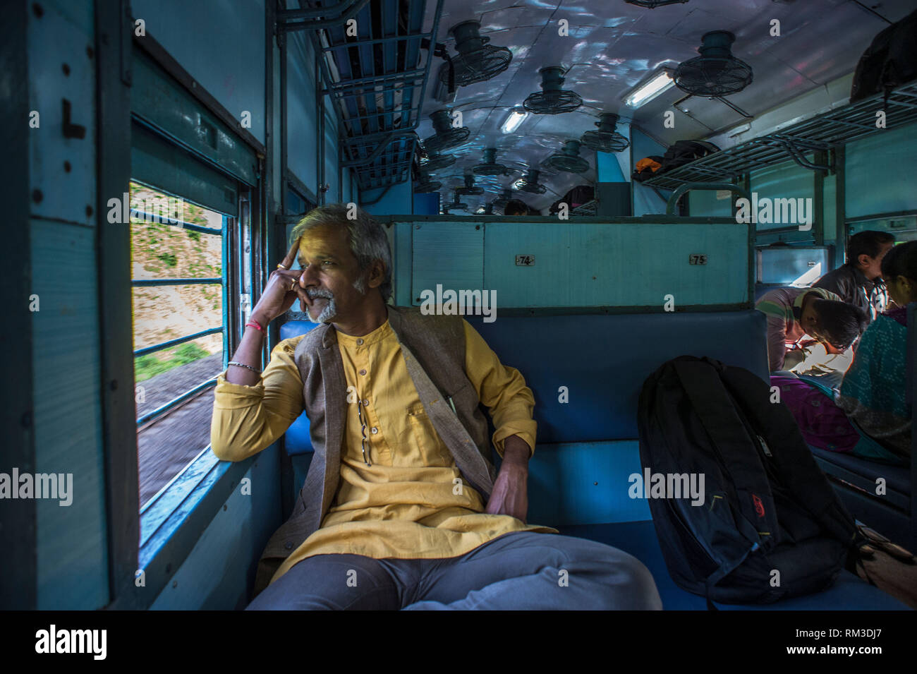 Man sitting, Train compartment, Gujarat, India, Asia Stock Photo