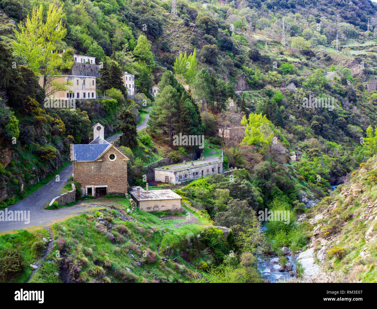 The abandoned village of La Cebadilla, built to house the workers on the hydro-electric installation at the upper end of the Poqueira Gorge in the Sie Stock Photo