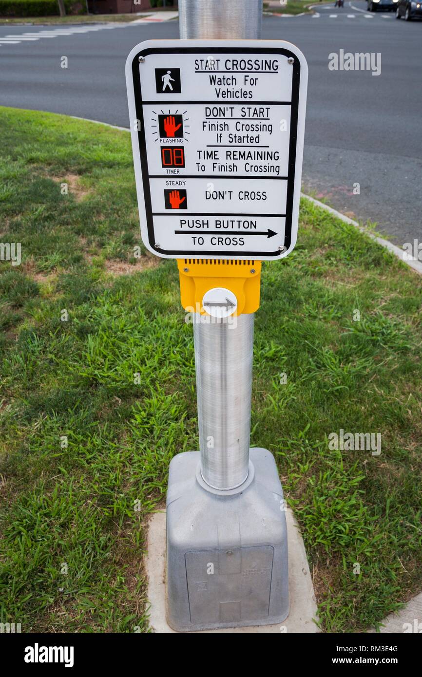 Button and crossing sign with instructions for pedestrian crossing ...