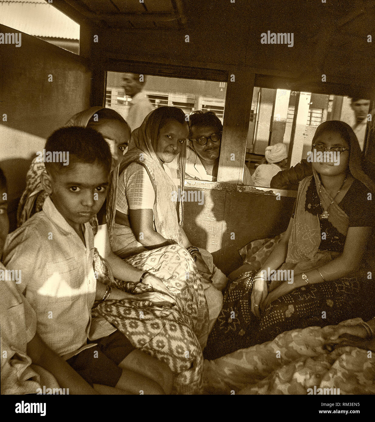 Vintage photo of Indian family in train compartment, Idar, Gujarat, India, Asia 1966 Stock Photo