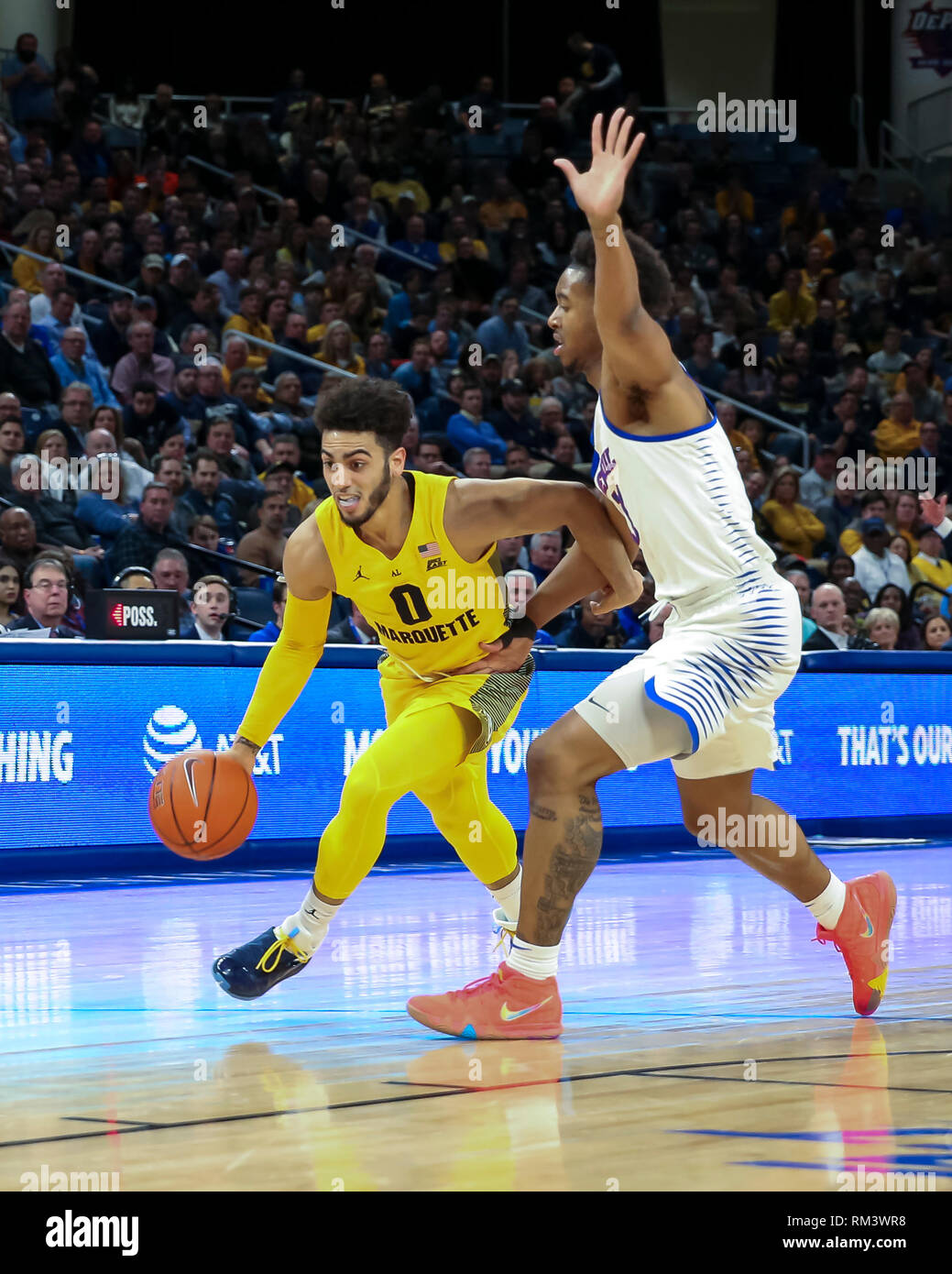 Chicago, USA. 12th Feb 2019. Marquette Golden Eagles guard Markus Howard (0) drives past the defense of DePaul Blue Demons guard Eli Cain (11) during NCAA basketball game between the Marquette Golden Eagles and the DePaul University Blue Demons at Wintrust Arena in Chicago IL. Gary E. Duncan Sr/CSM Credit: Cal Sport Media/Alamy Live News Stock Photo