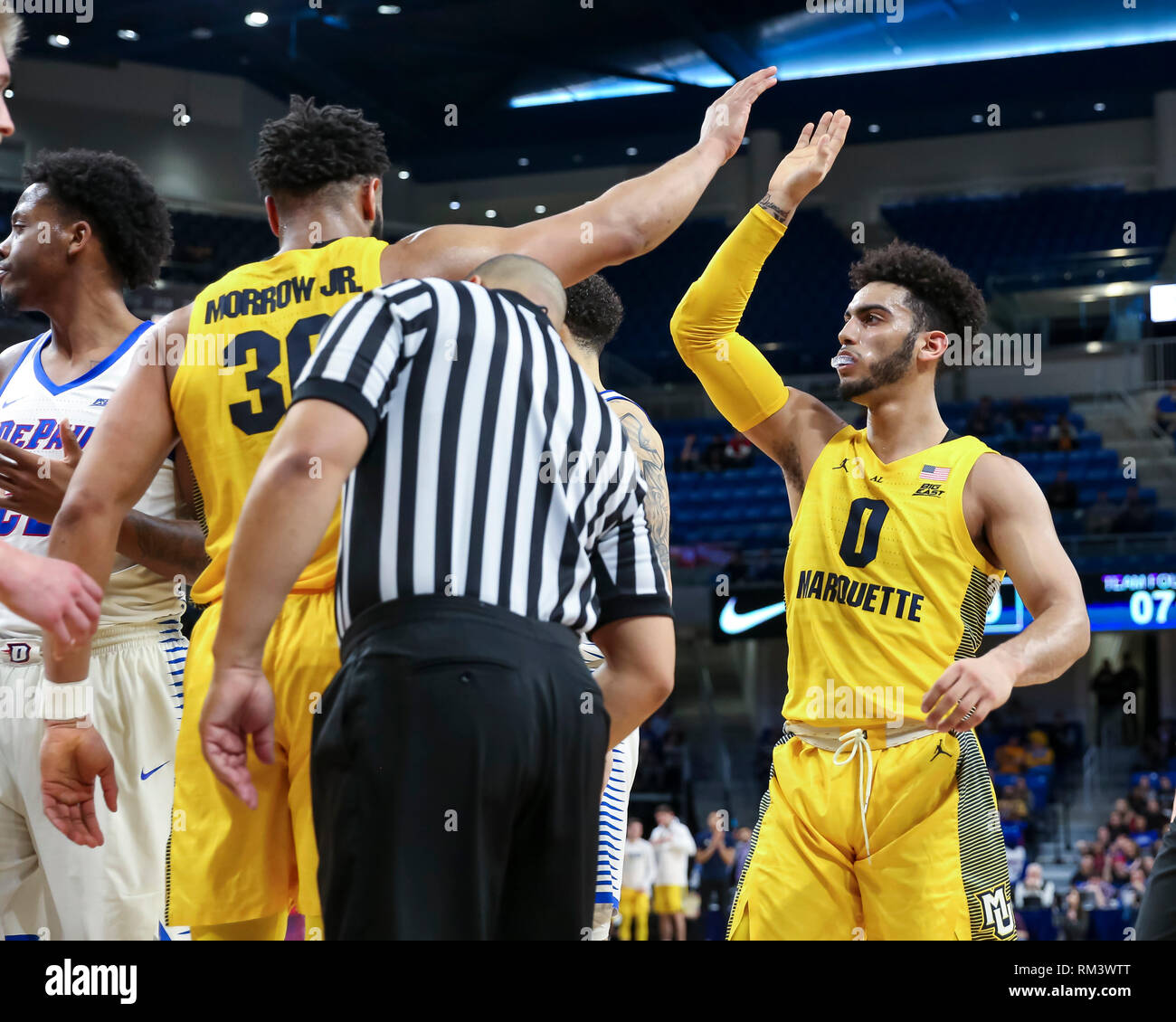 Chicago, USA. 12th Feb 2019. Marquette Golden Eagles guard Markus Howard (0) celebrates with Marquette Golden Eagles forward Ed Morrow (30) after he is fouled during NCAA basketball game between the Marquette Golden Eagles and the DePaul University Blue Demons at Wintrust Arena in Chicago IL. Gary E. Duncan Sr/CSM Credit: Cal Sport Media/Alamy Live News Stock Photo