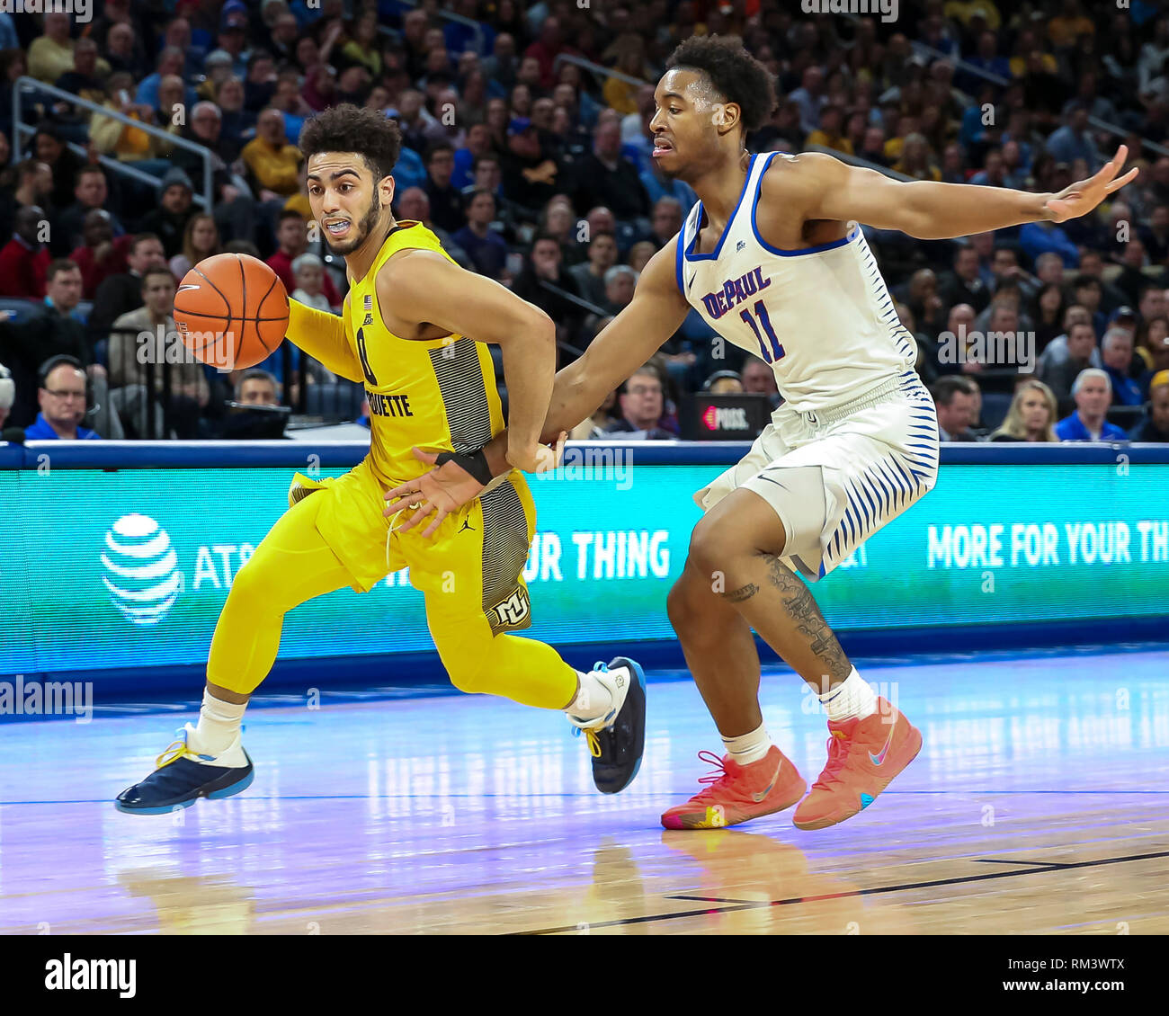 Chicago, USA. 12th Feb 2019. Marquette Golden Eagles guard Markus Howard (0) drives past the defense of DePaul Blue Demons guard Eli Cain (11) during NCAA basketball game between the Marquette Golden Eagles and the DePaul University Blue Demons at Wintrust Arena in Chicago IL. Gary E. Duncan Sr/CSM Credit: Cal Sport Media/Alamy Live News Stock Photo