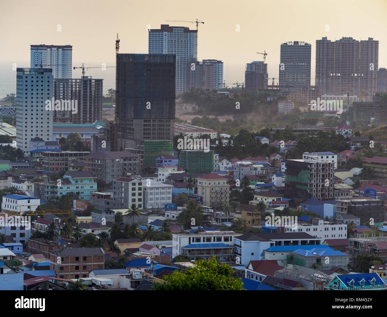 Sihanoukville, Preah Sihanouk, Cambodia. 13th Feb, 2019. Casinos under construction tower over the old section of Sihanoukville. There are about 80 Chinese casinos and resort hotels open in Sihanoukville and dozens more under construction. The casinos are changing the city, once a sleepy port on Southeast Asia's ''backpacker trail'' into a booming city. The change is coming with a cost though. Many Cambodian residents of Sihanoukville have lost their homes to make way for the casinos and the jobs are going to Chinese workers, brought in to build casinos and work in the casinos. (Credit I Stock Photo