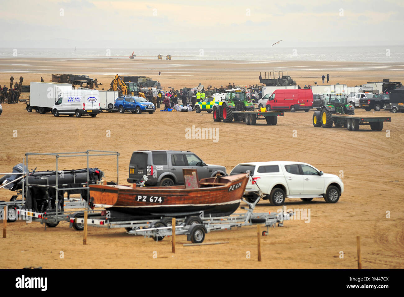 St Annes,Lancashire,UK. 13th Febuary 2019. BBC television War drama World on Fire,is filmed on St Annes beach,Lancashire. Production staff,actors and vehicles were gathered on the wide expanse of beach for the making of the epic story set during the second World War. Kev Walsh/Alamy Live News Stock Photo