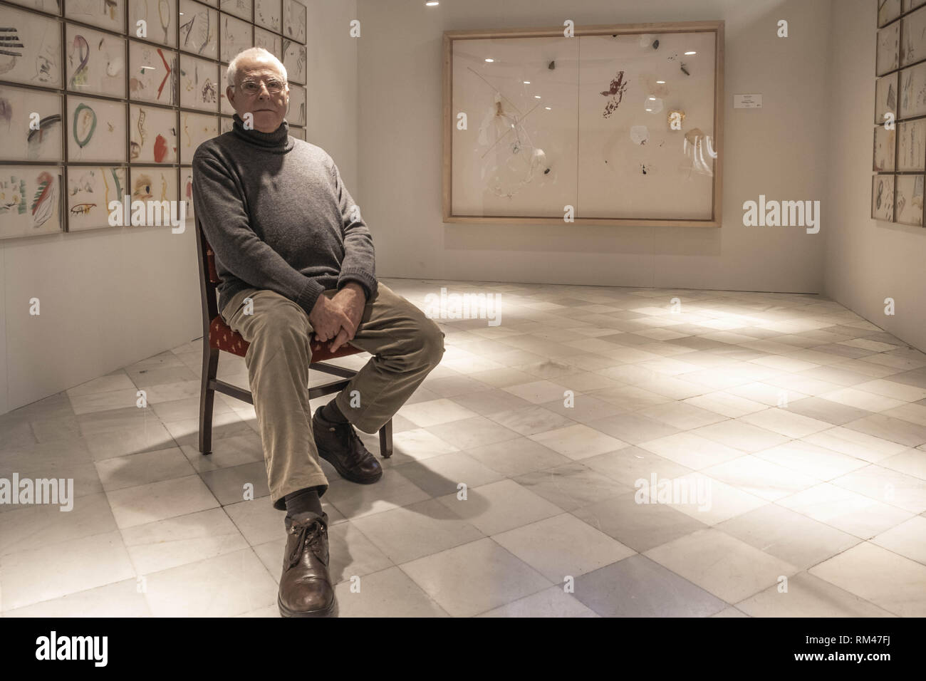 Barcelona, Catalonia, Spain. 13th Feb, 2019. The artist Antoni LLena is seen during the presentation of his new exhibition in the rooms of the Palau de la MÃºsica Catalana.The historic catalan artist Antoni Llena has presented his temporary project ''Signs of smoke from the subsoil''. The exhibition that is shown in the rooms of the Palau de la MÃºsica Catalana, collects 100 drawings that will be shown until March 19, 2019. Credit: Paco Freire/SOPA Images/ZUMA Wire/Alamy Live News Stock Photo