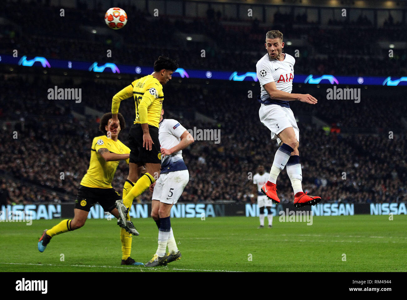 London, UK. 13th Feb, 2019. Toby Alderweireld of Tottenham Hotspur (R) heads a chance at goal but just misses. UEFA Champions league match, round of 16, 1st leg match, Tottenham Hotspur v Borussia Dortmund at Wembley Stadium in London on Wednesday 13th February 2019. this image may only be used for Editorial purposes. Editorial use only, license required for commercial use. No use in betting, games or a single club/league/player publications . pic by Steffan Bowen/Andrew Orchard sports photography/Alamy Live news Credit: Andrew Orchard sports photography/Alamy Live News Stock Photo