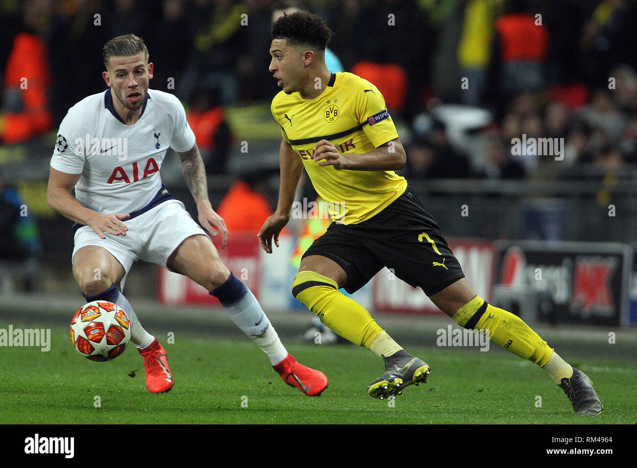 London, UK. 13th Feb, 2019. Jadon Sancho of Borussia Dortmund (R) in action with Toby Alderweireld of Tottenham Hotspur (L). UEFA Champions league match, round of 16, 1st leg match, Tottenham Hotspur v Borussia Dortmund at Wembley Stadium in London on Wednesday 13th February 2019. this image may only be used for Editorial purposes. Editorial use only, license required for commercial use. No use in betting, games or a single club/league/player publications . pic by Steffan Bowen/Andrew Orchard sports photography/Alamy Live news Credit: Andrew Orchard sports photography/Alamy Live News Stock Photo