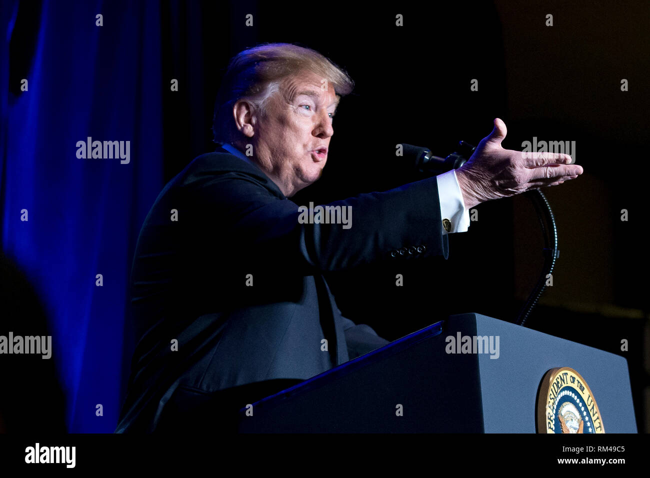 US President Donald J. Trump gestures while delivering remarks at the Major County Sheriffs and Major Cities Chiefs Association Joint Conference, in Washington, DC, USA, 13 February 2019. Trump took the opportunity to deliver remarks on his border-security and immigration policy. Republican leaders are asking Trump to sign legislation that allocates about 1.375 billion USD (1.218 billion euros) for over fifty miles of physical barriers along the border. Signing the agreement would prevent another partial shutdown of the federal government that would begin 16 February. Credit: Michael Reynolds Stock Photo