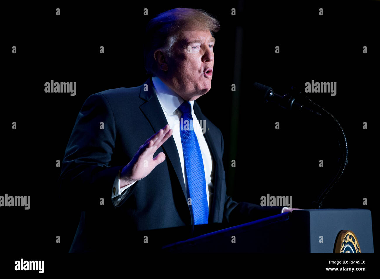US President Donald J. Trump gestures while delivering remarks at the Major County Sheriffs and Major Cities Chiefs Association Joint Conference, in Washington, DC, USA, 13 February 2019. Trump took the opportunity to deliver remarks on his border-security and immigration policy. Republican leaders are asking Trump to sign legislation that allocates about 1.375 billion USD (1.218 billion euros) for over fifty miles of physical barriers along the border. Signing the agreement would prevent another partial shutdown of the federal government that would begin 16 February. Credit: Michael Reynolds Stock Photo
