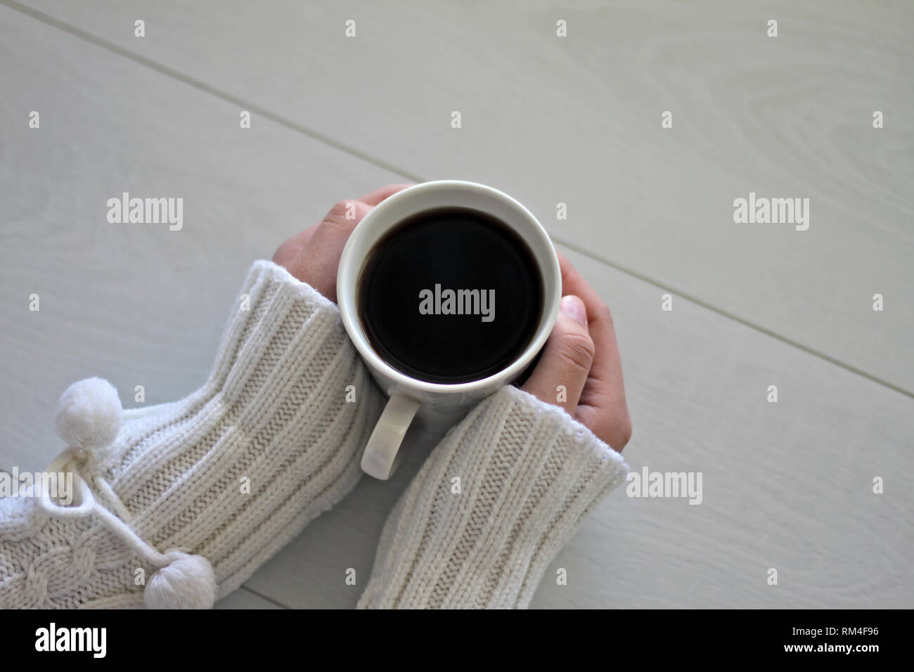 Cup of coffee in female hands on a gray gentle background Stock Photo ...