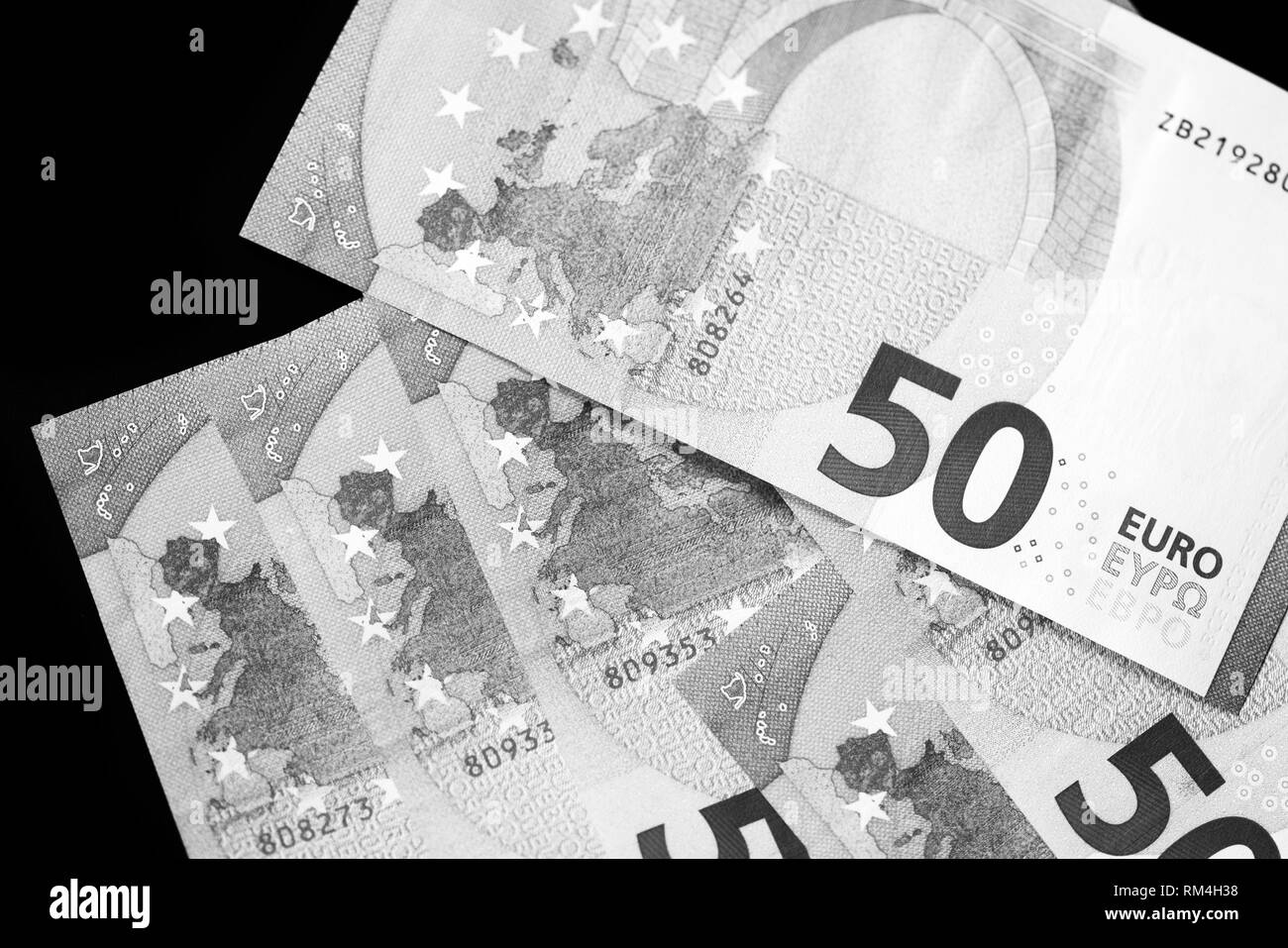 fifty-euro-banknotes-on-a-dark-background-close-up-black-and-white