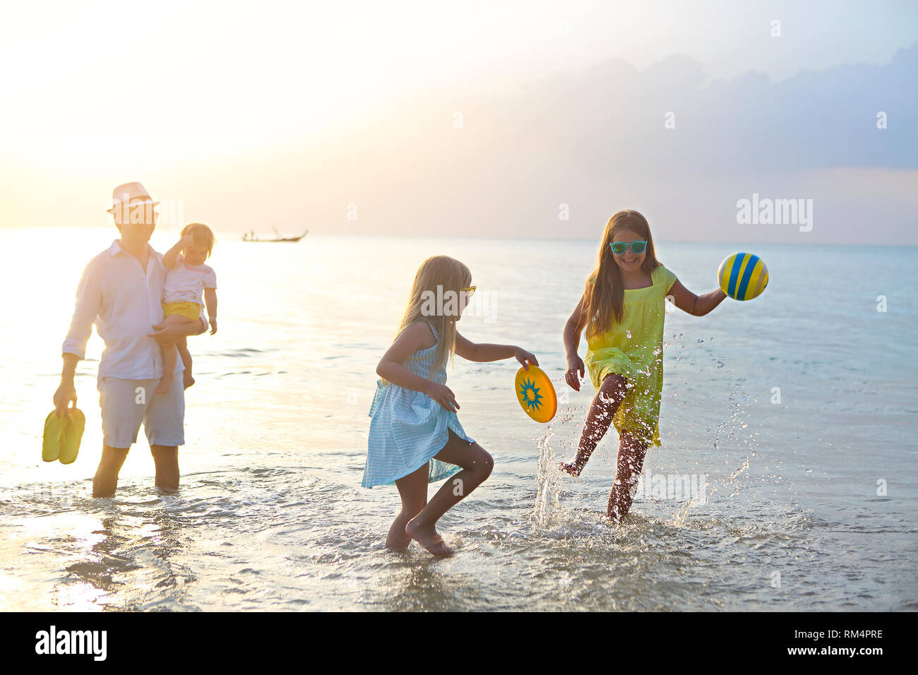 Happy kids beach ball hi-res stock photography and images - Alamy