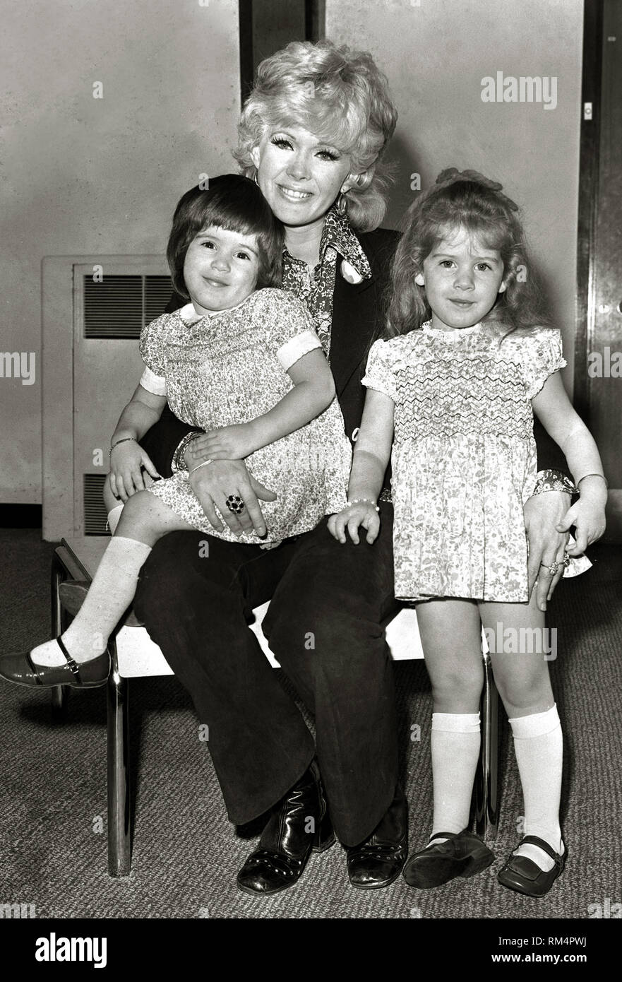 Connie Stevens, with her children Tricia Leigh Fisher (left, aged 2) and Joely Fisher,(right, aged 3,) (1971)  File Reference # 33751 223THA Stock Photo