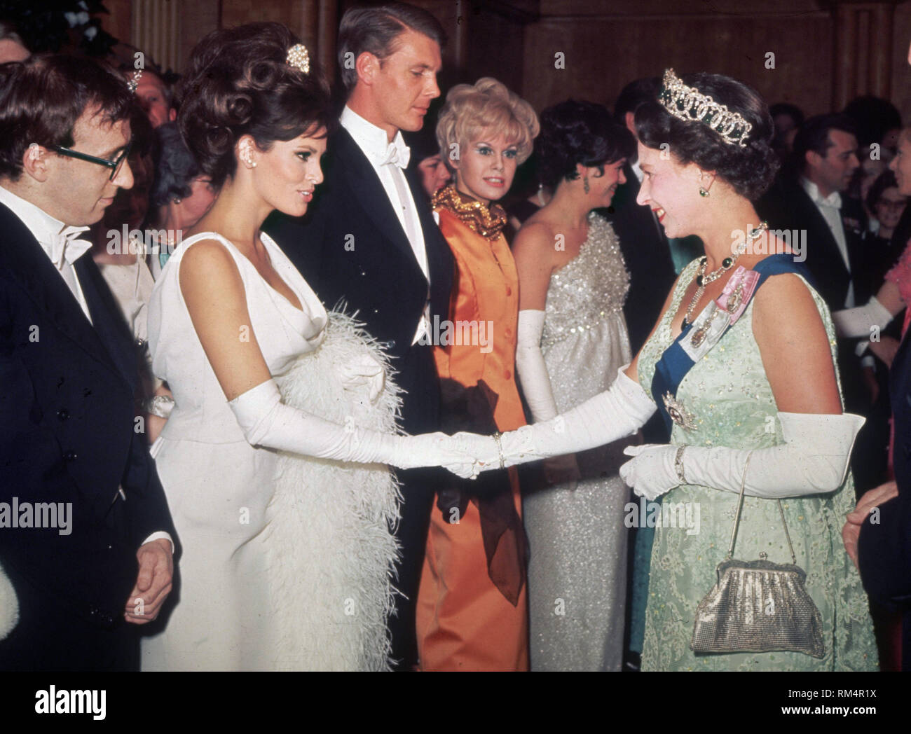 Raquel Welch Shaking Hands With Queen Elizabeth Ii Of Great