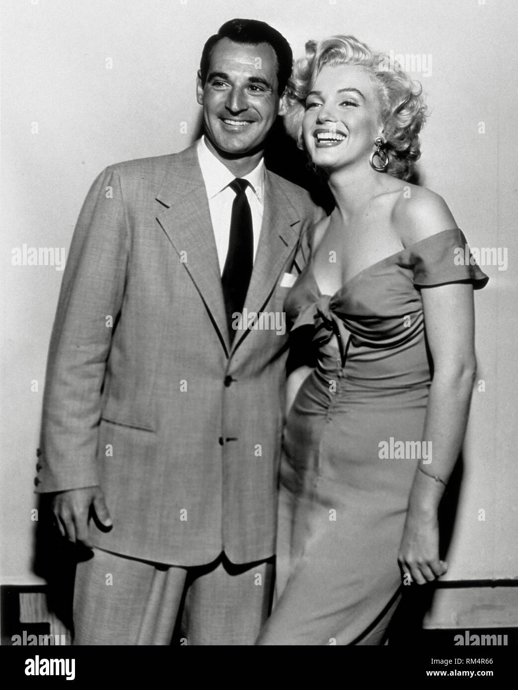 Ray Anthony, Marilyn Monroe, at a party hosted by Ray  Anthony on August 3, 1952 in honor of Marilyn Monroe and the release of a new recording "Marilyn" (1952)  File Reference # 33751_092THA Stock Photo
