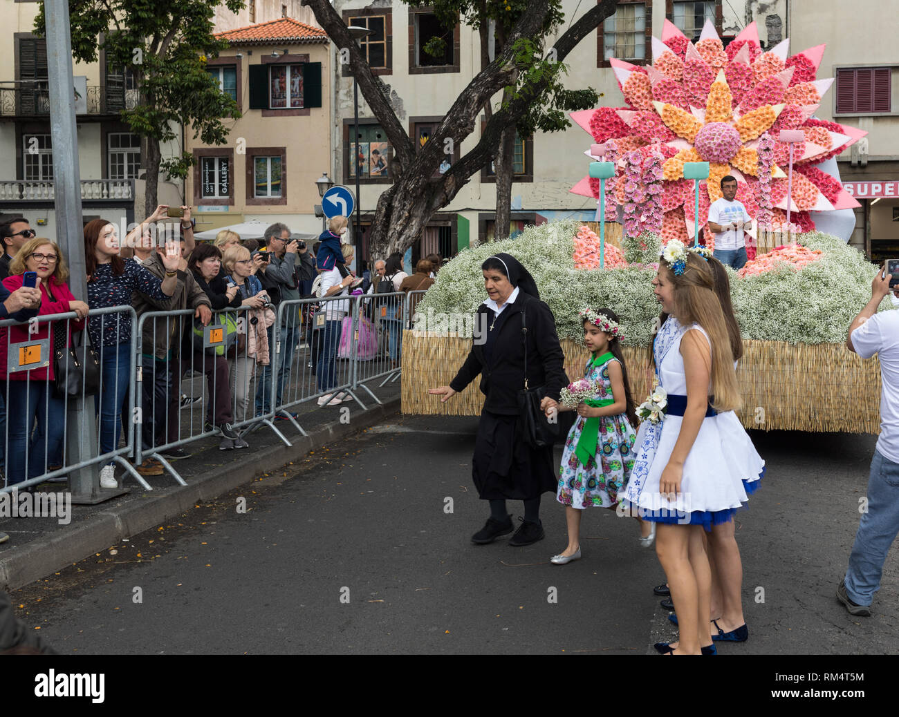 Funchal; Madeira; Portugal - April 22; 2018: The last moments before the parade, Girls in a colorful costumes at the Madeira Flower Festival , Funchal Stock Photo