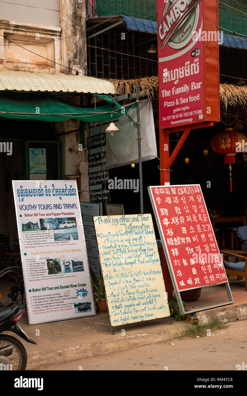 Cambodia, Kampot Province, Kampot city, Old Market area, Vouthy Tours and Travel, signs outside travel agency Stock Photo