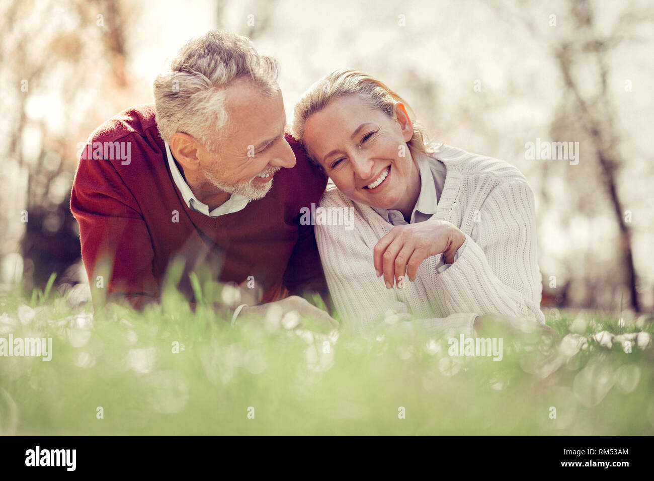Mature couple lying grass hi-res stock photography and images - Alamy