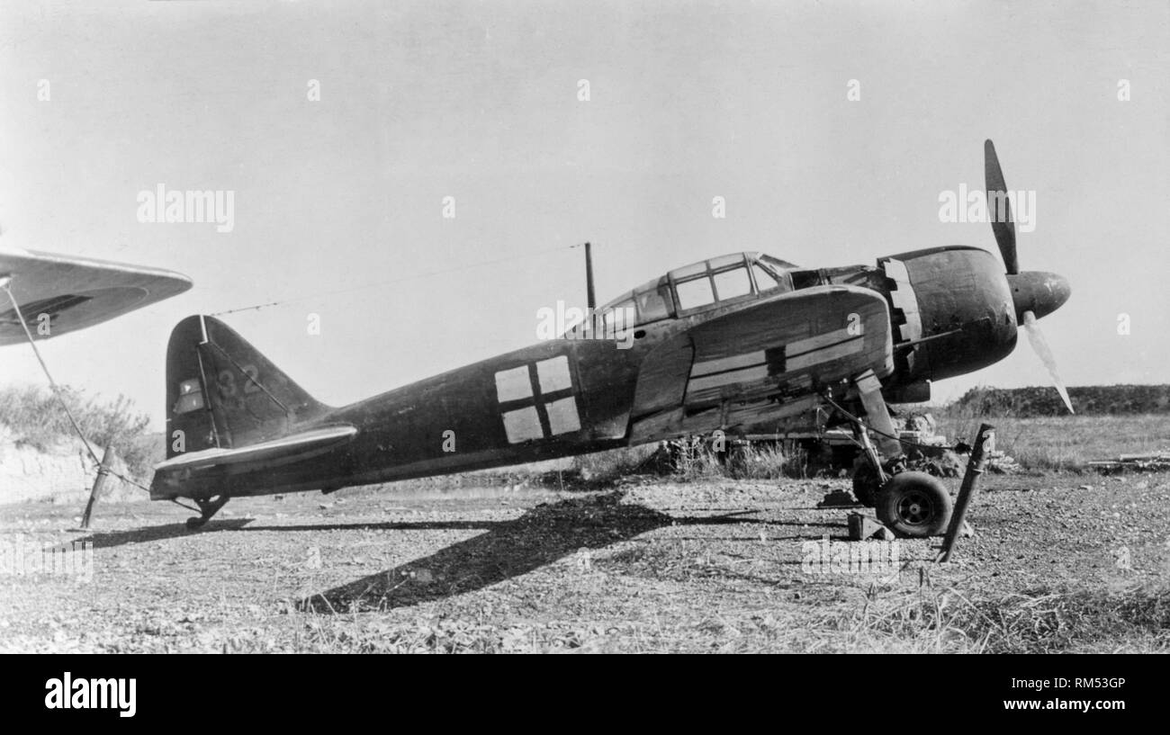 1945. Japan. A captured World War Two Japanese Air Force Mitsubishi Zero fighter, painted with the green cross over a white background, the surrender marking of the Japanese Forces. Stock Photo