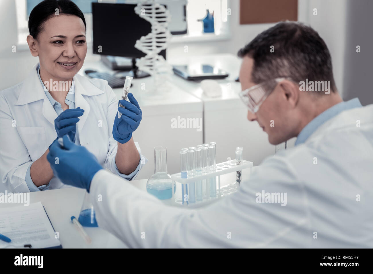 Two scientists working in the laboratory on the important issue Stock Photo